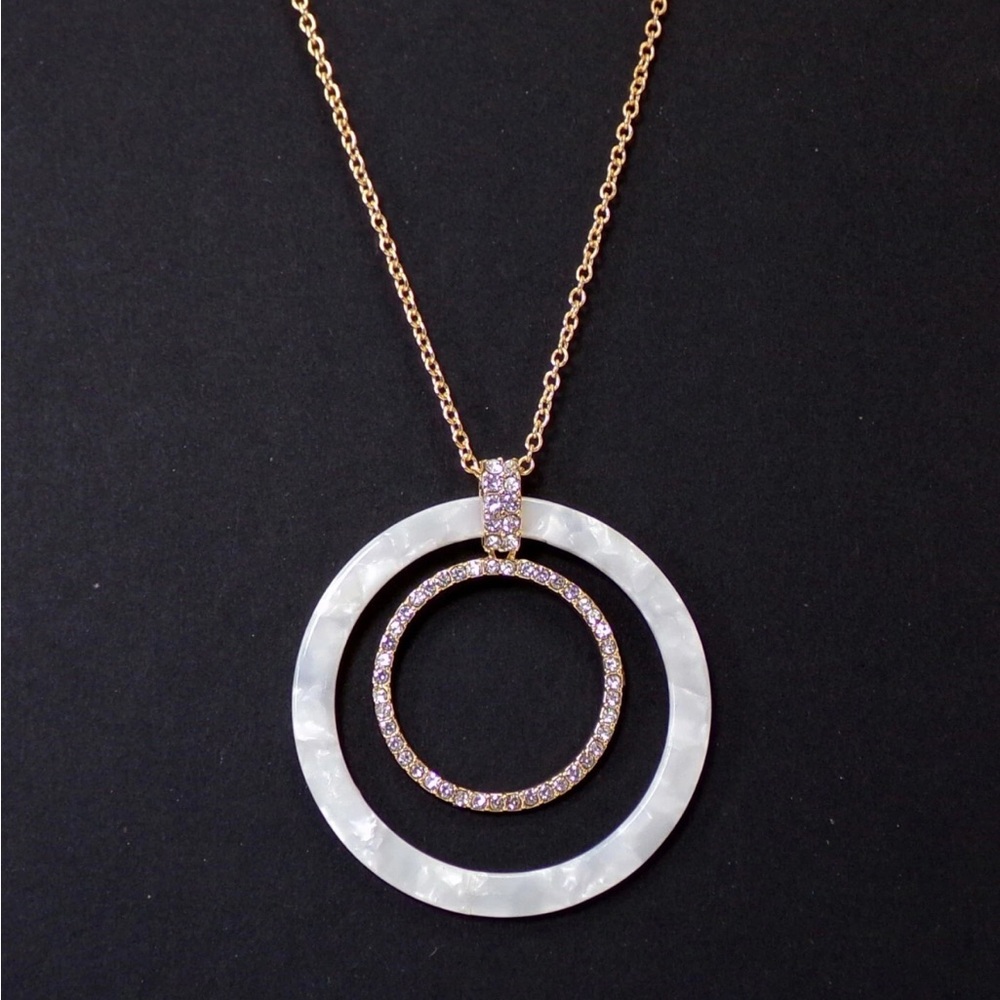 Large round crystal and white disk pendant necklace on long gold chain